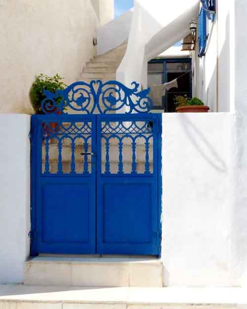 blue main iron gate with bright walls